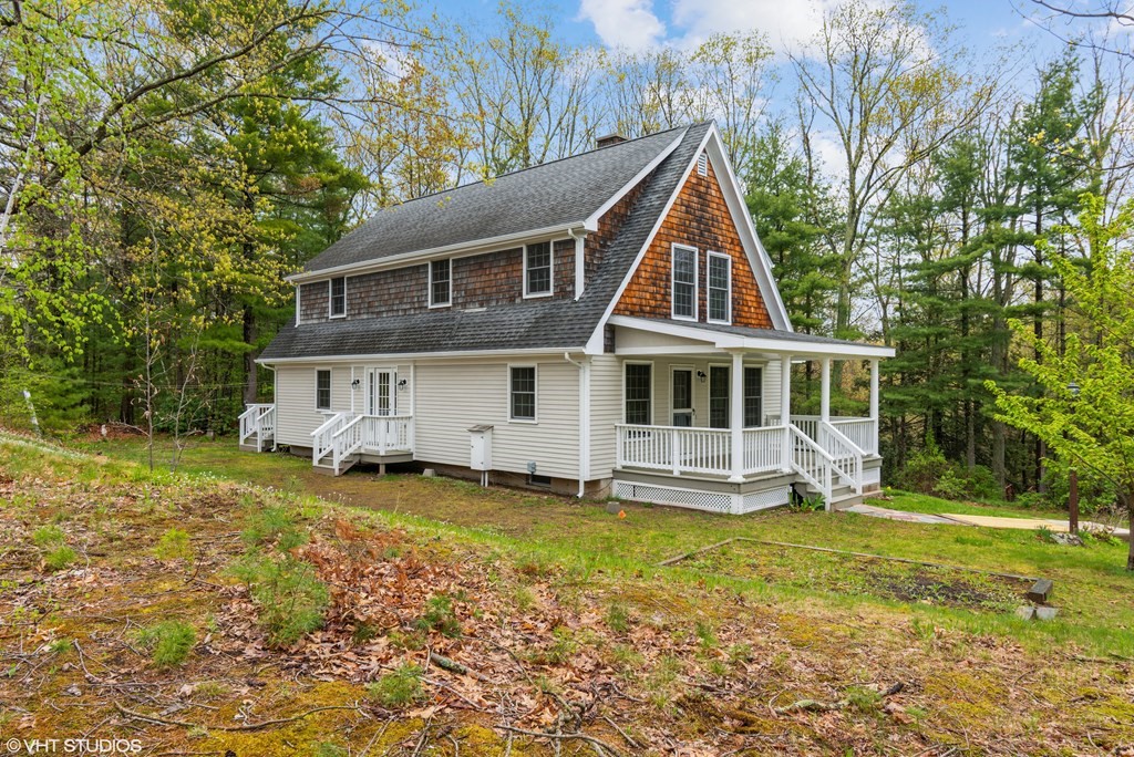 106 Martin Farms Road Hampden, MA 01036 - Photo 33 of 34 a front view of a house with a yard