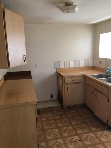 a utility room with sink dryer and washer