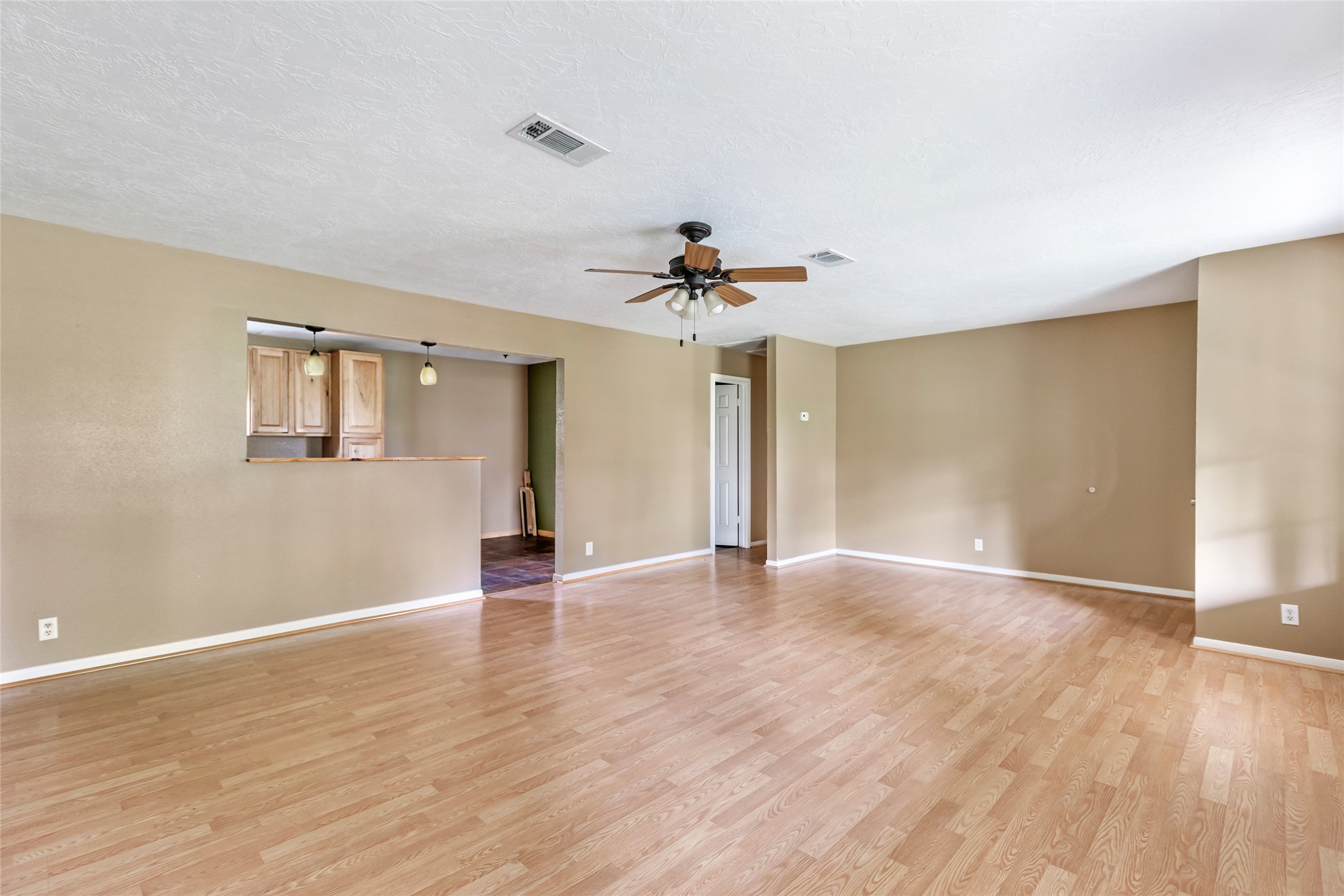 27311 Kingport Drive Splendora, TX 77372 - Photo 16 of 26 a view of an empty room with window and wooden floor