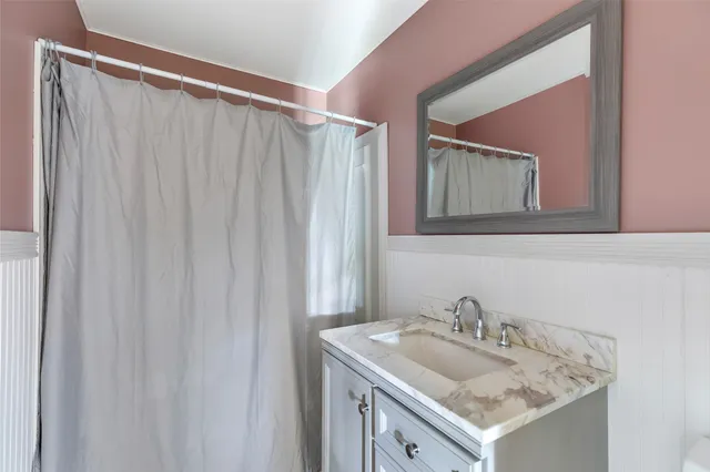 a kitchen with stainless steel appliances granite countertop a refrigerator stove top oven and sink