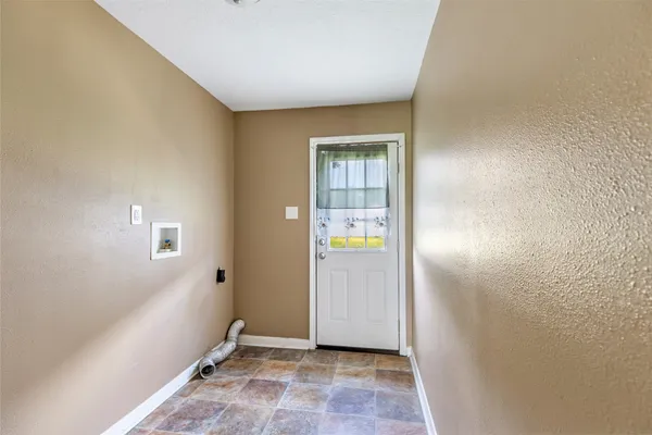 a view of a livingroom with a ceiling fan and window