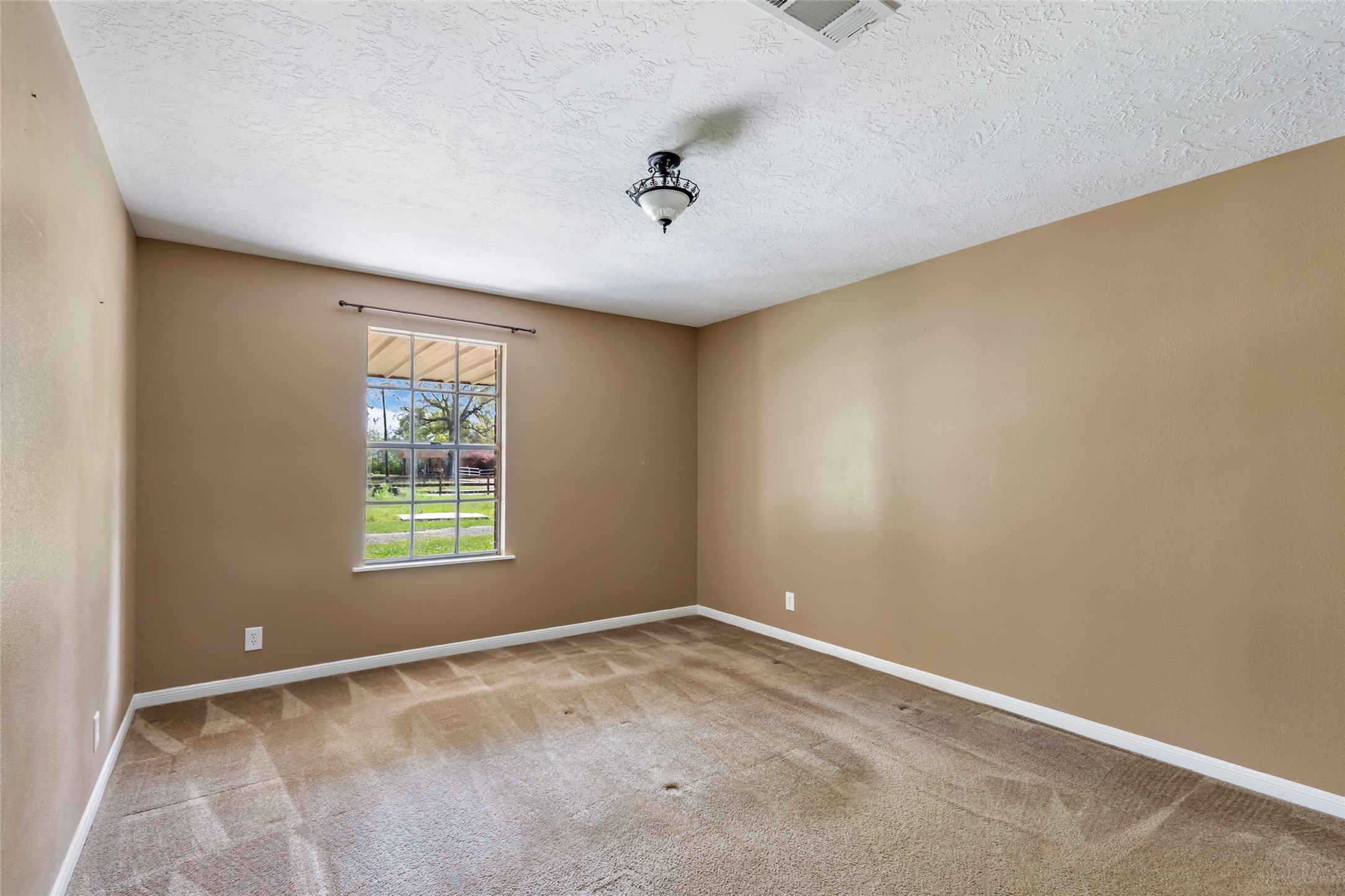 27311 Kingport Drive Splendora, TX 77372 - Photo 24 of 26 an empty room with a window