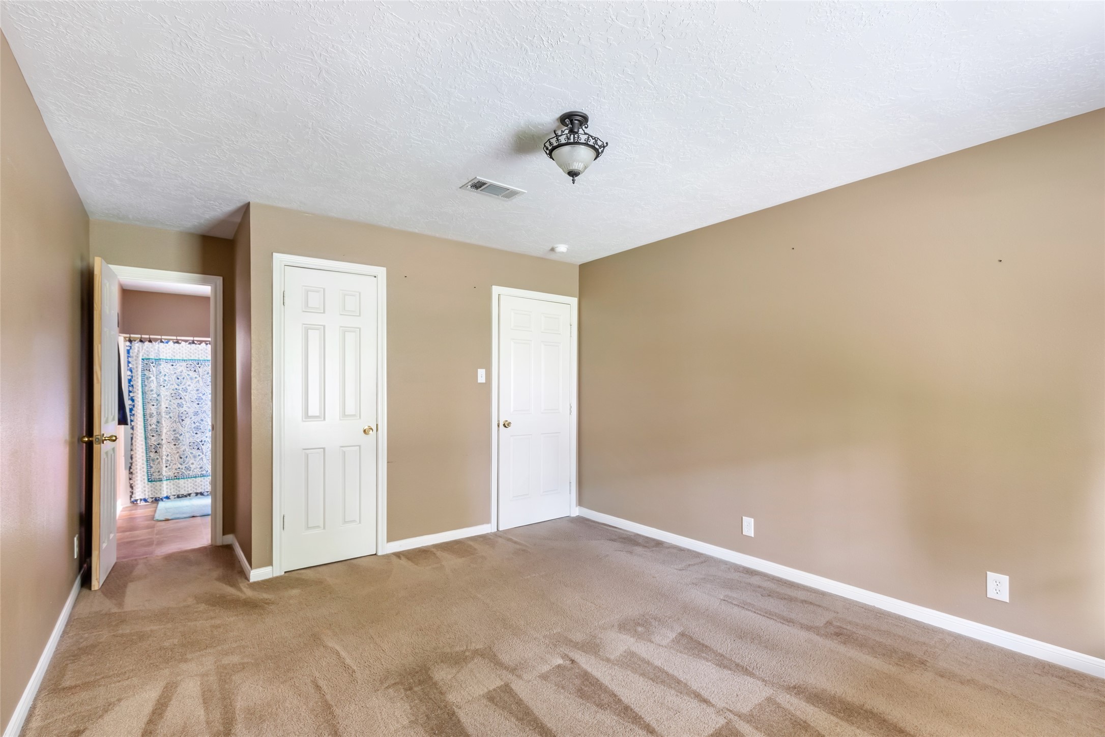 27311 Kingport Drive Splendora, TX 77372 - Photo 25 of 26 a view of a livingroom with a ceiling fan and window