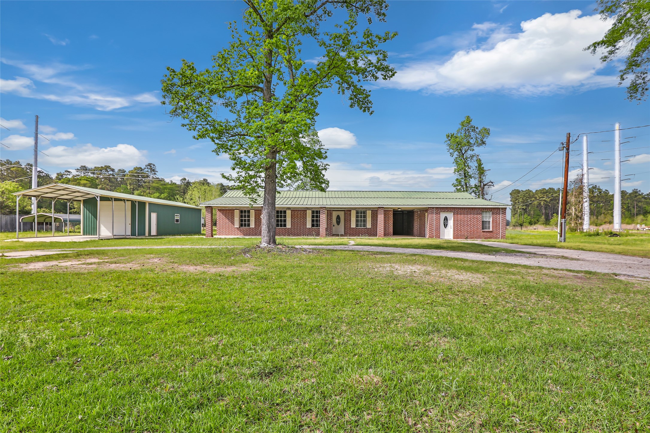 27311 Kingport Drive Splendora, TX 77372 - Photo 3 of 26 a front view of a house with a garden