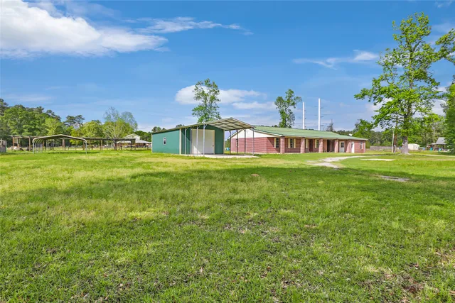 a view of a house with a big yard