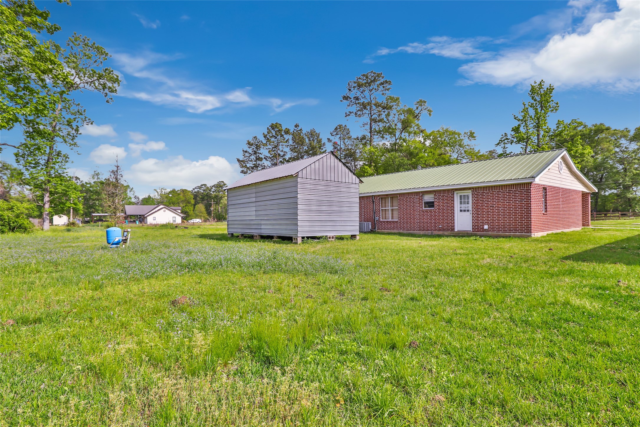 27311 Kingport Drive Splendora, TX 77372 - Photo 8 of 26 a view of a house with a yard