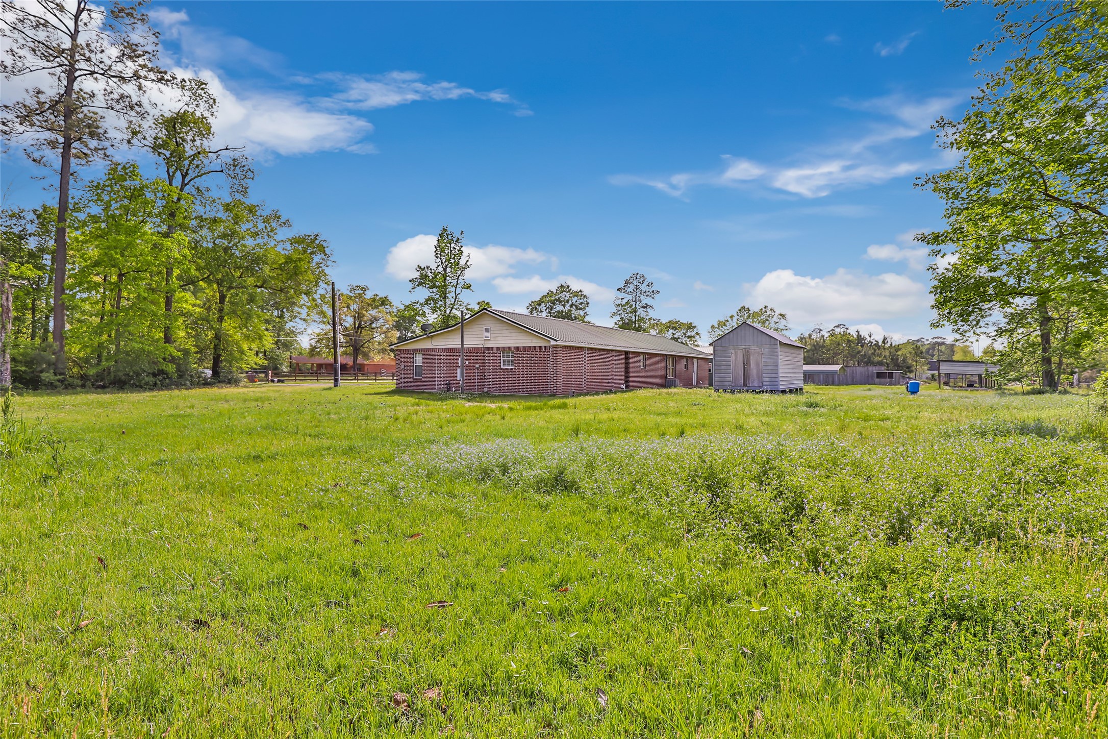 27311 Kingport Drive Splendora, TX 77372 - Photo 10 of 26 a view of a house with a yard