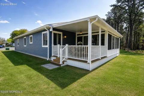 a view of a house with a yard and deck