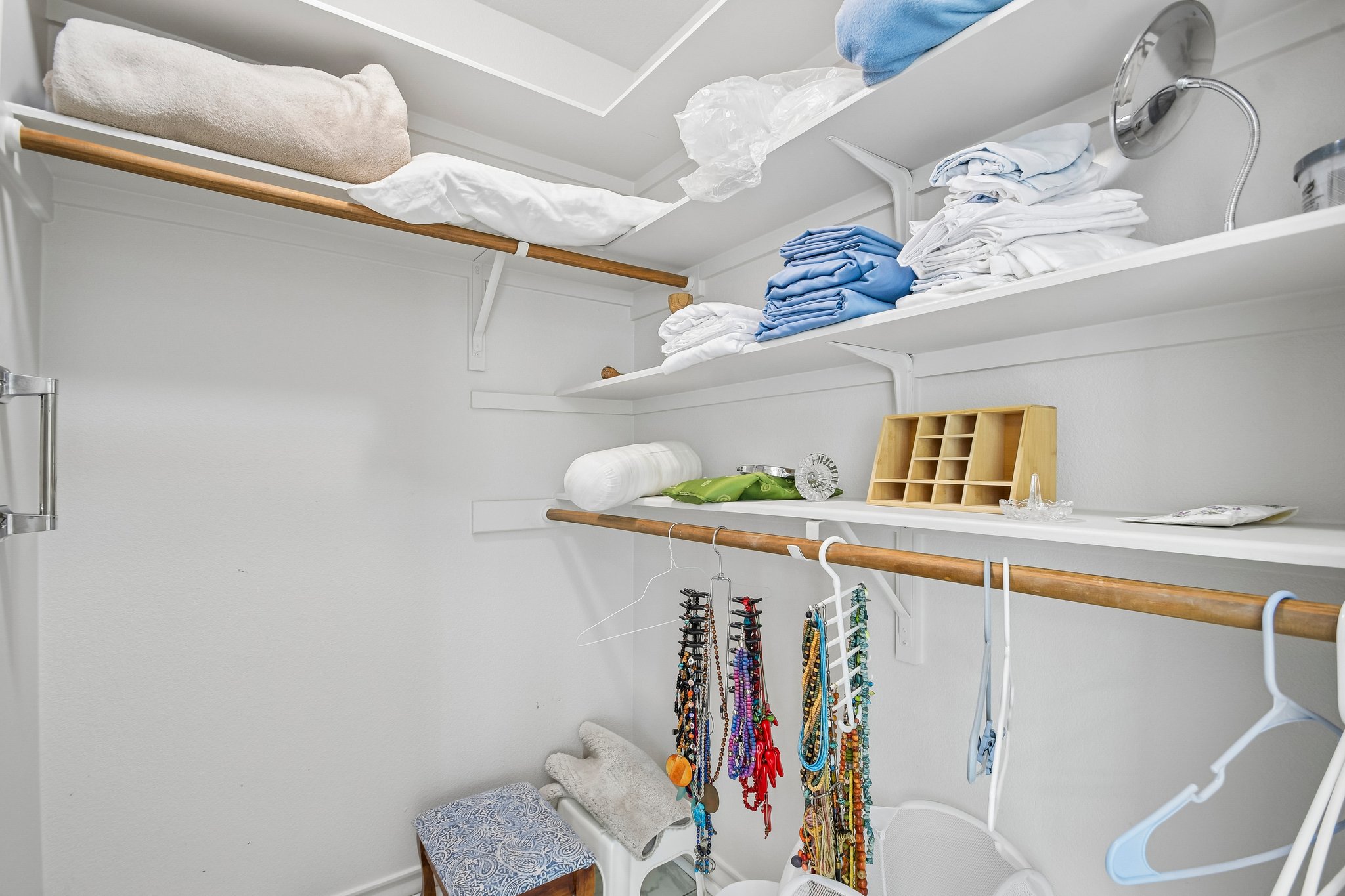 307 West 4th Street Elgin, TX 78621 - Photo 23 of 40 White closet system featuring multiple shelves and hanging rods