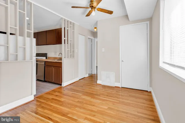 a view of a kitchen with a stove cabinets and wooden floor