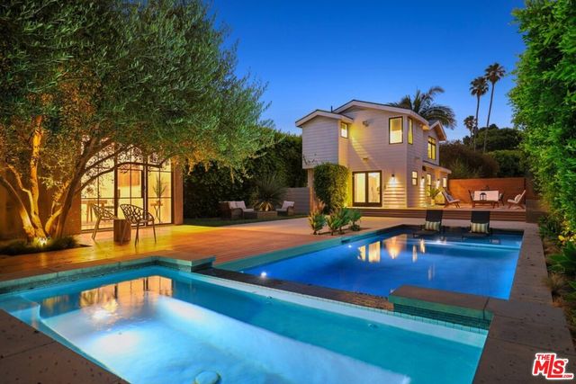 a view of a swimming pool with a lounge chairs
