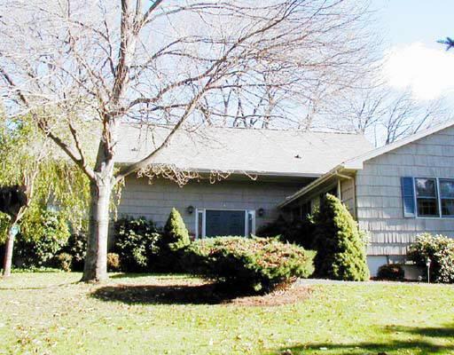 12 Westmoreland Road Ridgefield, CT 06877 - Photo 1 of 1 a front view of a house with garden