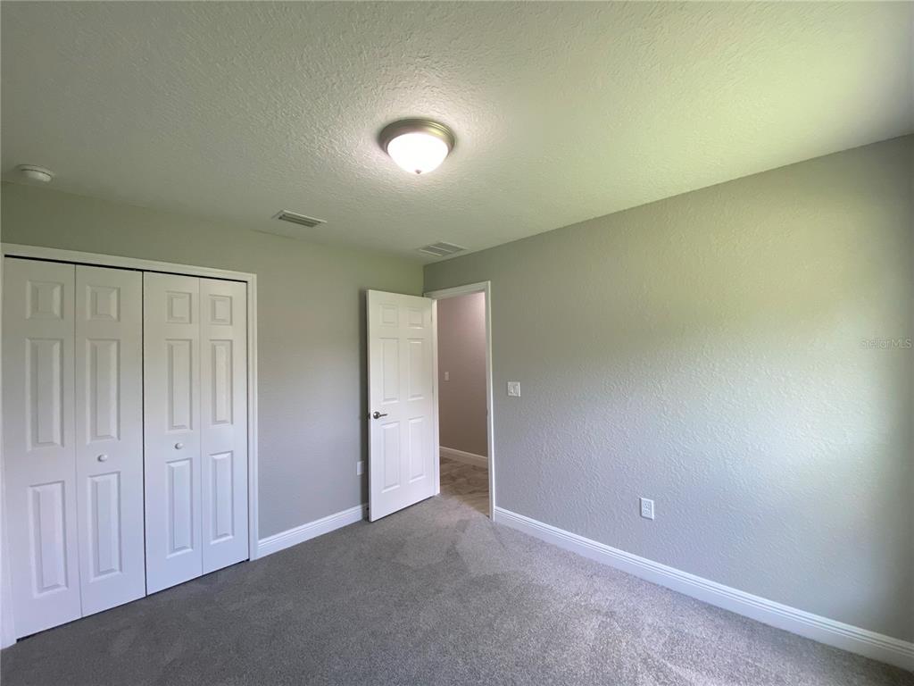 15298 Southwest 43rd Court Ocala, FL 34473 - Photo 12 of 26 an empty room with closet area