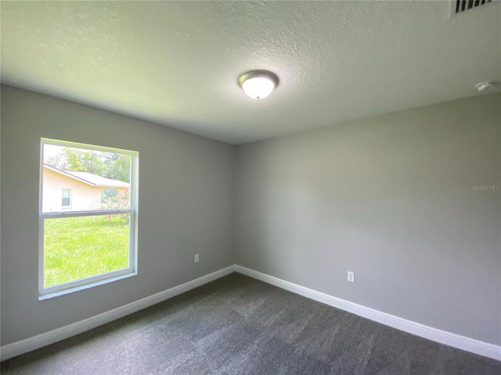 15298 Southwest 43rd Court Ocala, FL 34473 - Photo 13 of 26 an empty room with a window