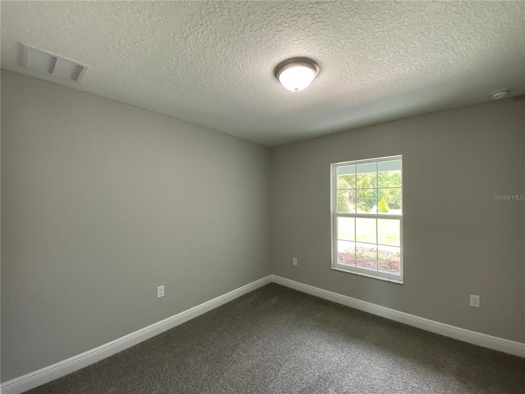 15298 Southwest 43rd Court Ocala, FL 34473 - Photo 16 of 26 an empty room with a window