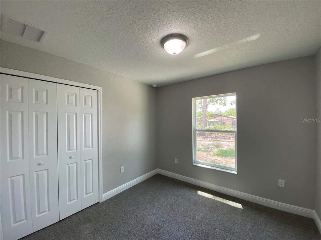 15298 Southwest 43rd Court Ocala, FL 34473 - Photo 18 of 26 an empty room with windows