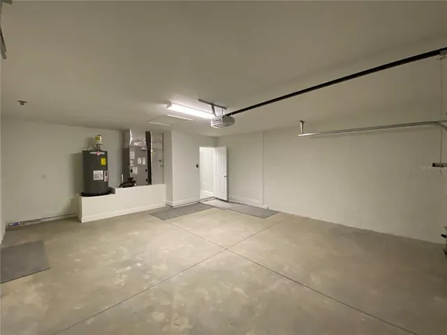 a view of an empty room with a empty space and a window