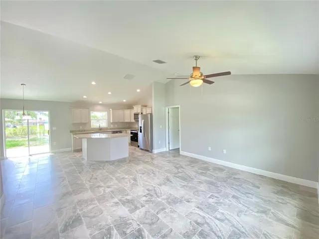 a view of a kitchen with a sink and cabinets