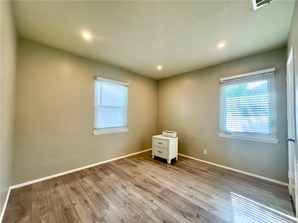 7454 Gaviota Avenue Van Nuys, CA 91406 - Photo 7 of 11 a view of empty room with wooden floor and fan