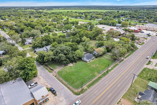 a view of a garden with a street