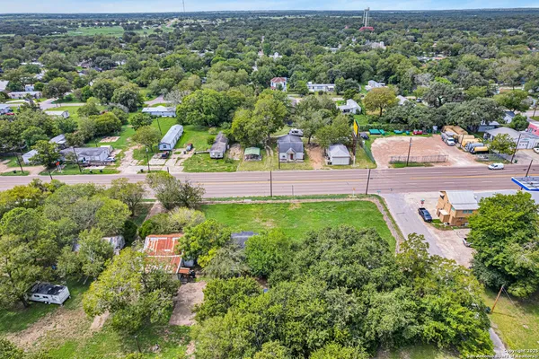 an aerial view of a house with a yard