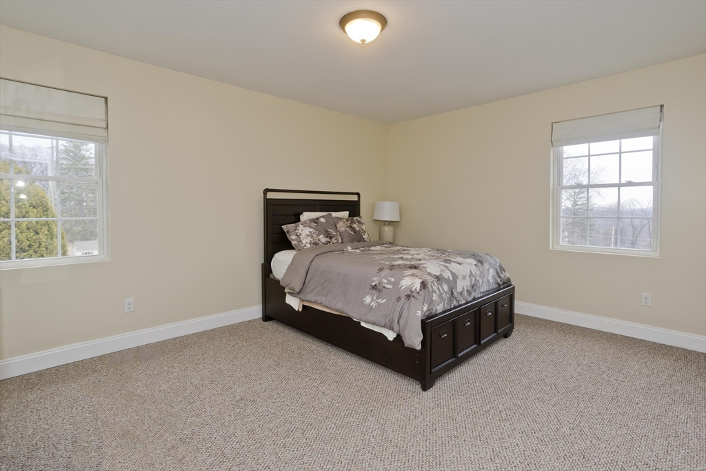 48 Mountain Avenue West Springfield, MA 01089 - Photo 22 of 39 a bed sitting in a bedroom next to a window