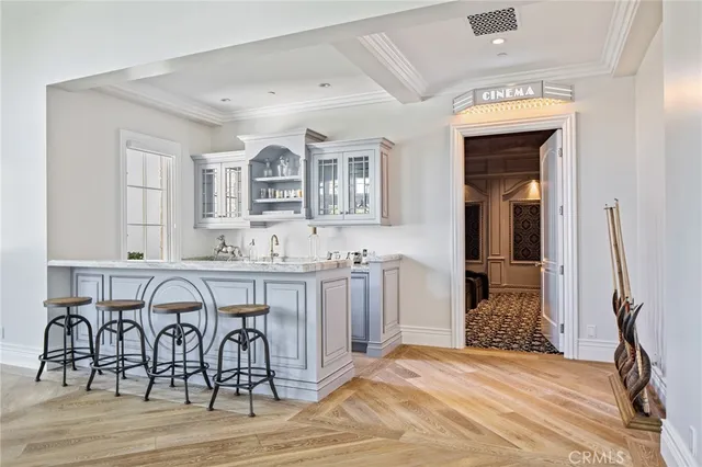 a view of a kitchen and dining area with chandelier