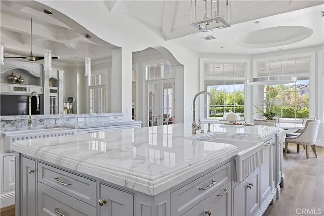 a bathroom with sinks a vanity and a large mirror