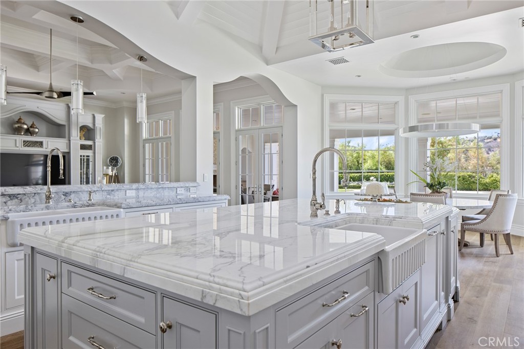 24100 Hidden Ridge Road Hidden Hills, CA 91302 - Photo 9 of 15 a bathroom with sinks a vanity and a large mirror