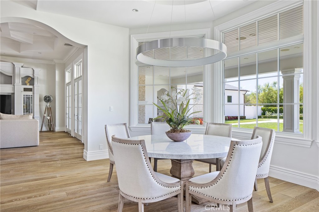 24100 Hidden Ridge Road Hidden Hills, CA 91302 - Photo 10 of 15 a view of a dining room with furniture and wooden floor