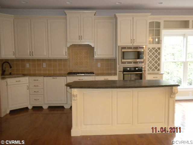 516 Hunt Field Road Manakin-Sabot, VA 23103 - Photo 5 of 9 a kitchen with granite countertop white cabinets and stainless steel appliances