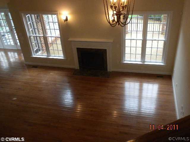 516 Hunt Field Road Manakin-Sabot, VA 23103 - Photo 6 of 9 a view of empty room with wooden floor and fan