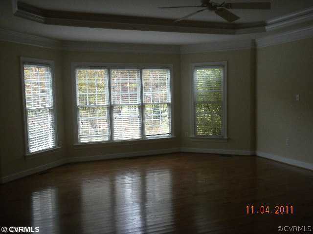 516 Hunt Field Road Manakin-Sabot, VA 23103 - Photo 9 of 9 a view of an empty room with wooden floor and a window
