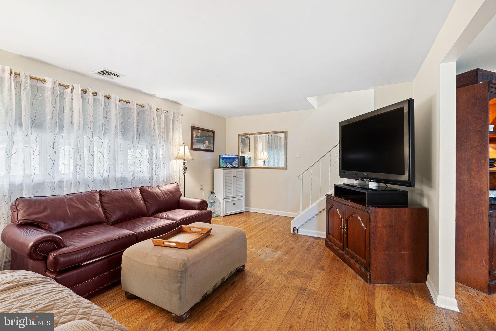 2 Waverly Road Havertown, PA 19083 - Photo 2 of 30 a living room with furniture and a flat screen tv