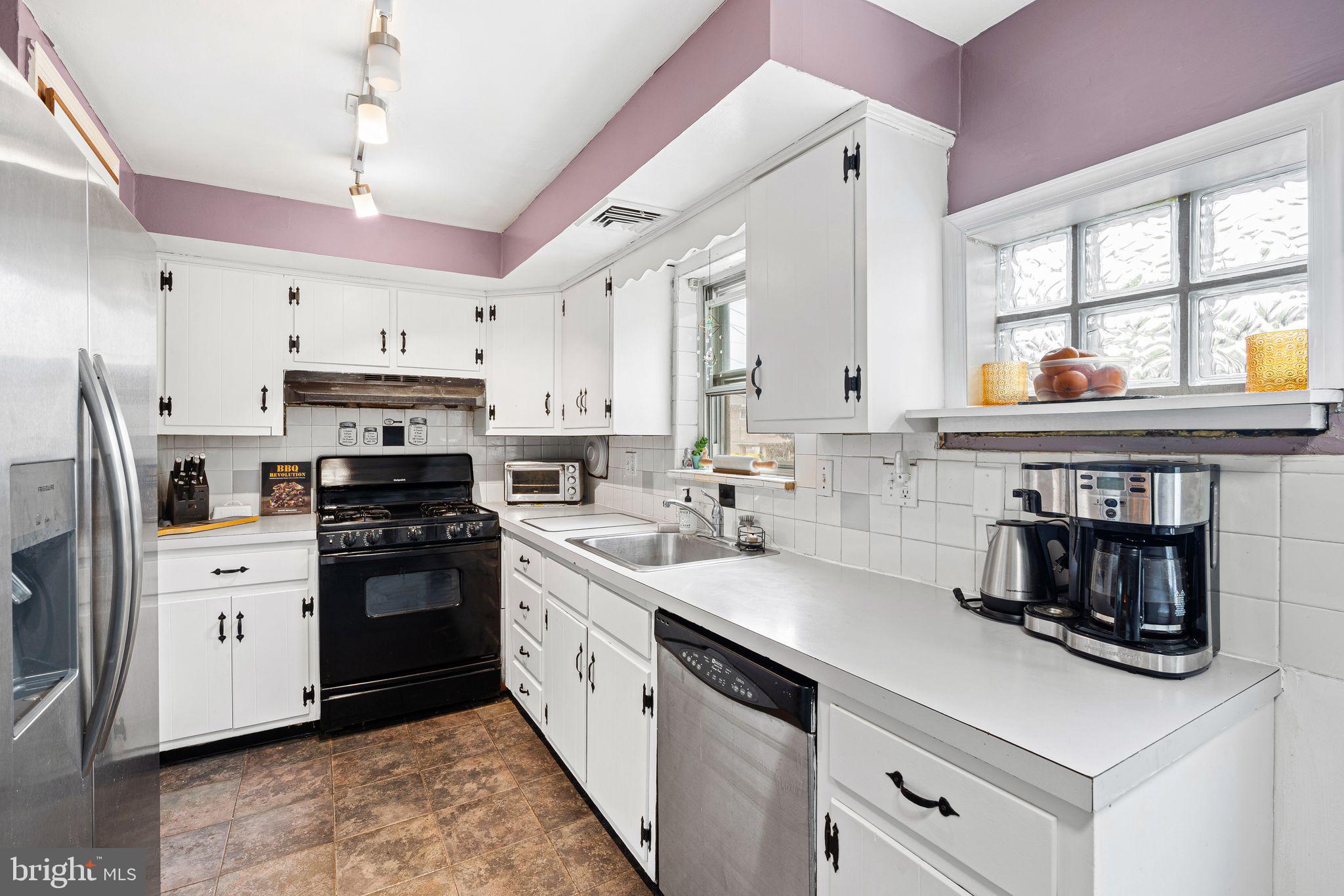 2 Waverly Road Havertown, PA 19083 - Photo 7 of 30 a kitchen with a sink stove and refrigerator