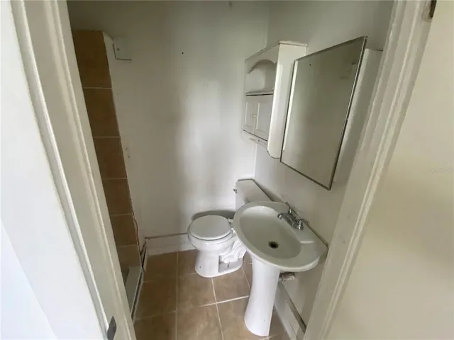 a bathroom with a toilet and a sink