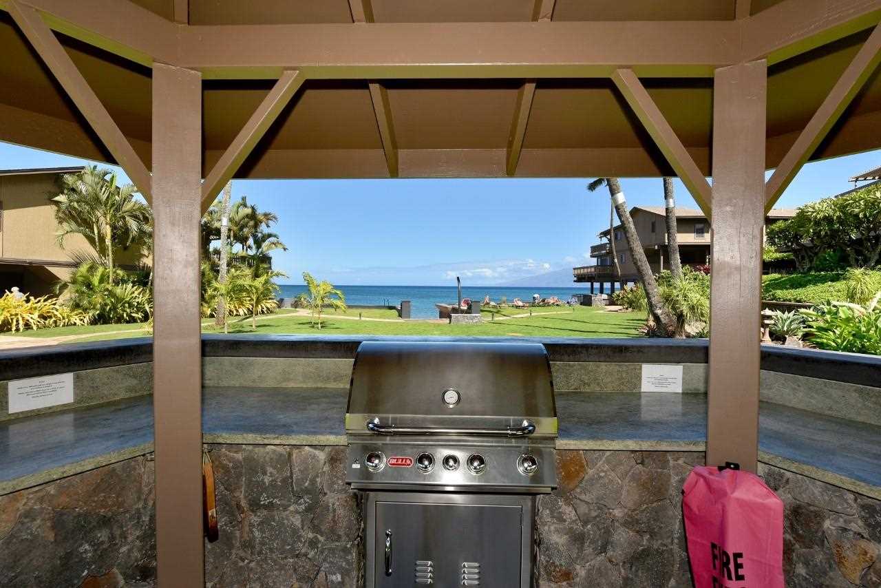 4909 Lower Honoapiilani Road, Unit E4 Lahaina, HI 96761 - Photo 20 of 30 a stove top oven sitting inside of a kitchen