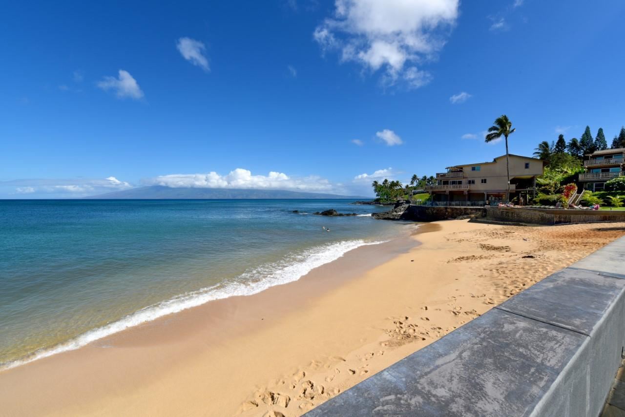 4909 Lower Honoapiilani Road, Unit E4 Lahaina, HI 96761 - Photo 24 of 30 a view of a yard with a lake view