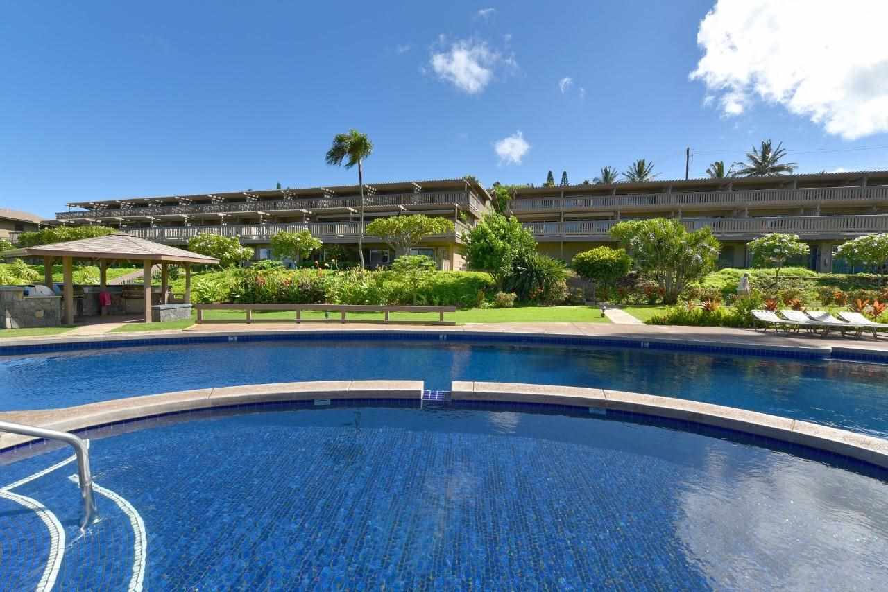 4909 Lower Honoapiilani Road, Unit E4 Lahaina, HI 96761 - Photo 26 of 30 a view of a lake with a houses in the back