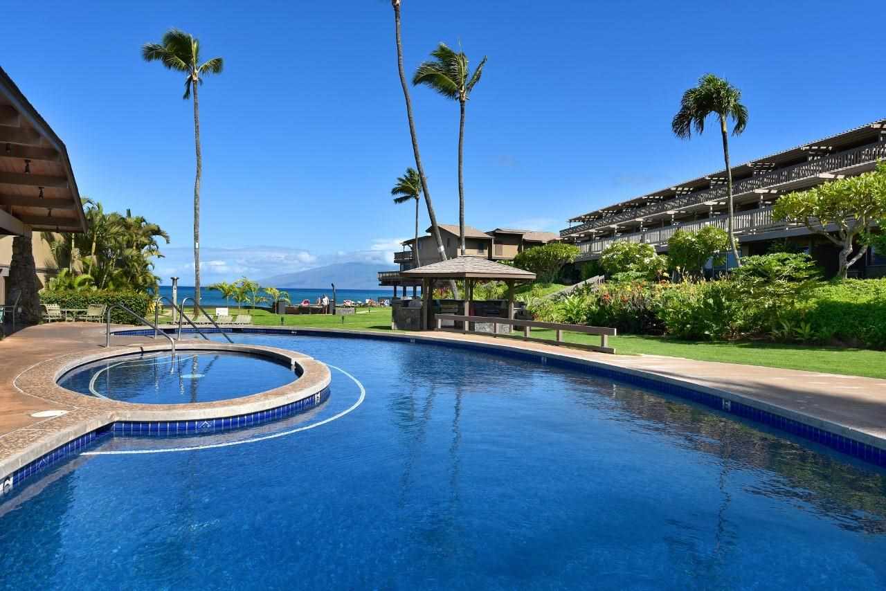 4909 Lower Honoapiilani Road, Unit E4 Lahaina, HI 96761 - Photo 27 of 30 a view of a swimming pool with a patio