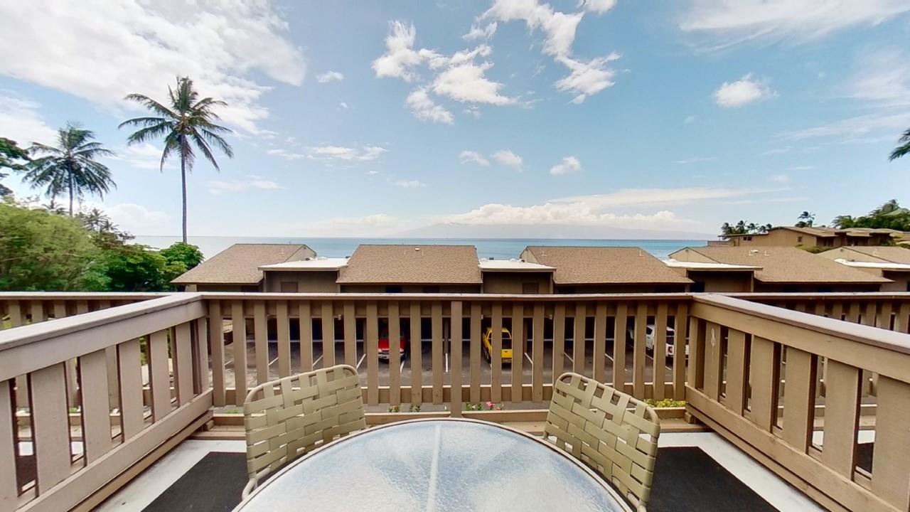 4909 Lower Honoapiilani Road, Unit E4 Lahaina, HI 96761 - Photo 5 of 30 a view of balcony with wooden floor