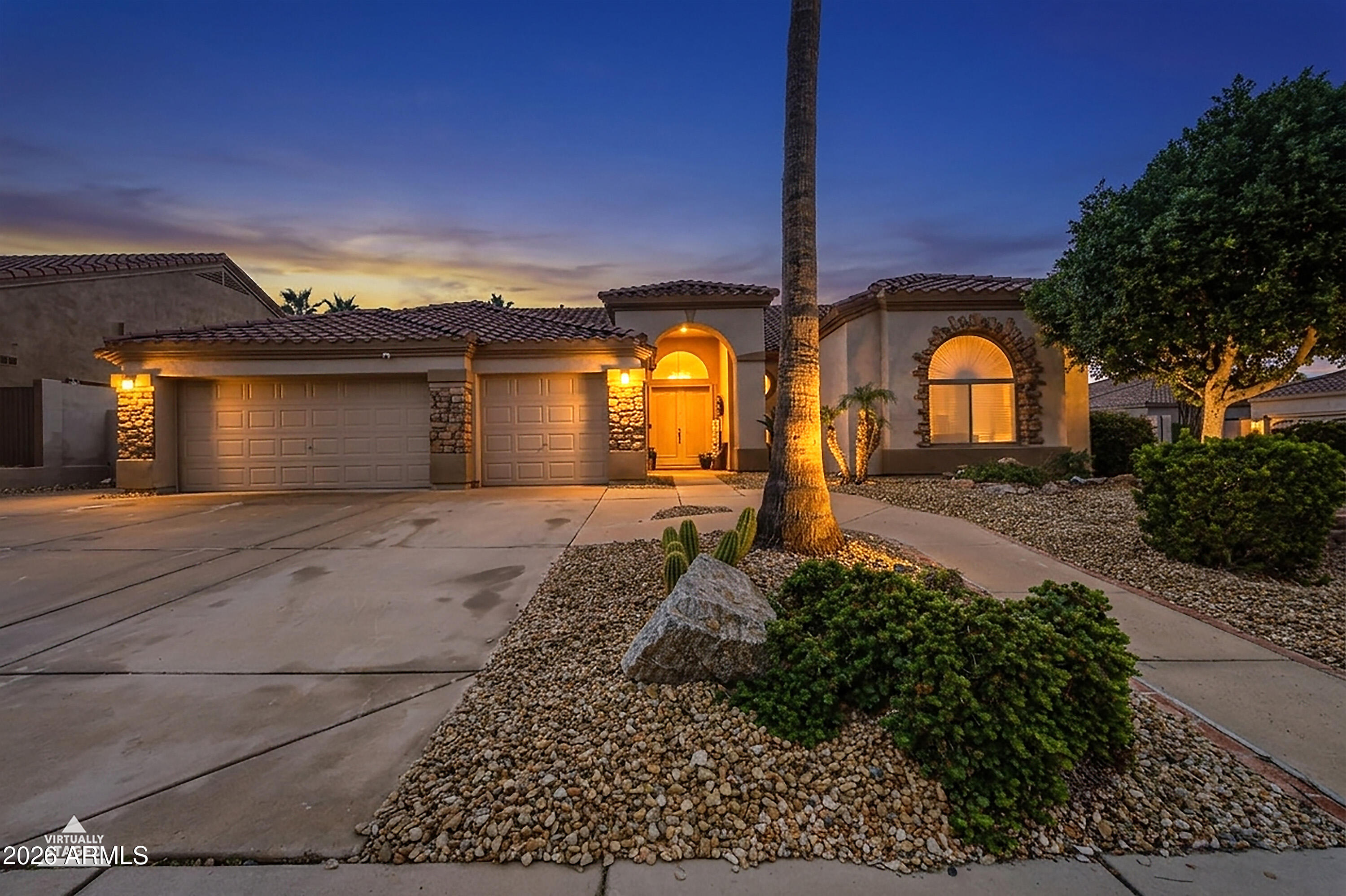 16635 South 12th Avenue Phoenix, AZ 85045 - Photo 1 of 43 a front view of a house with garden