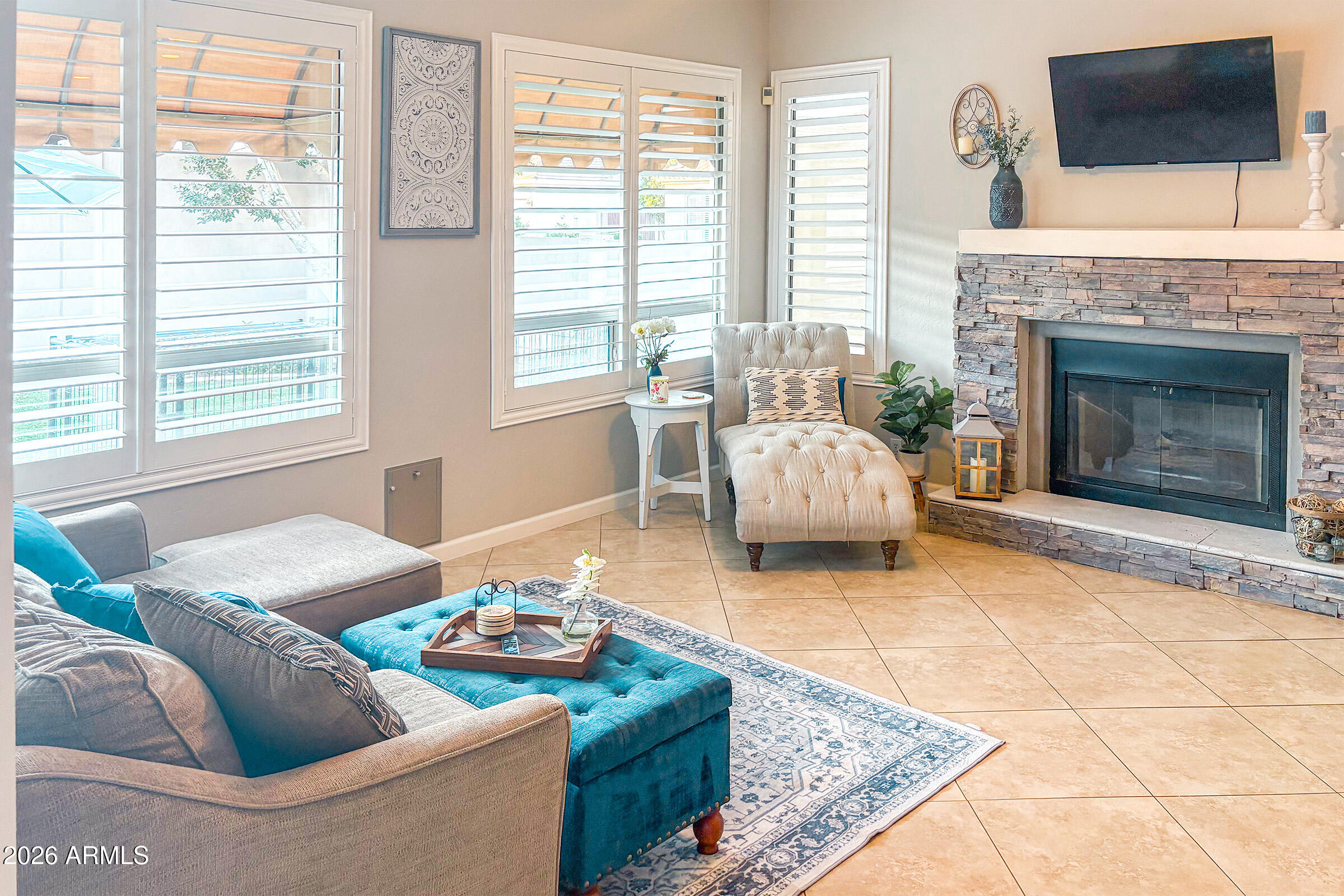 16635 South 12th Avenue Phoenix, AZ 85045 - Photo 12 of 43 a living room with furniture and a fireplace
