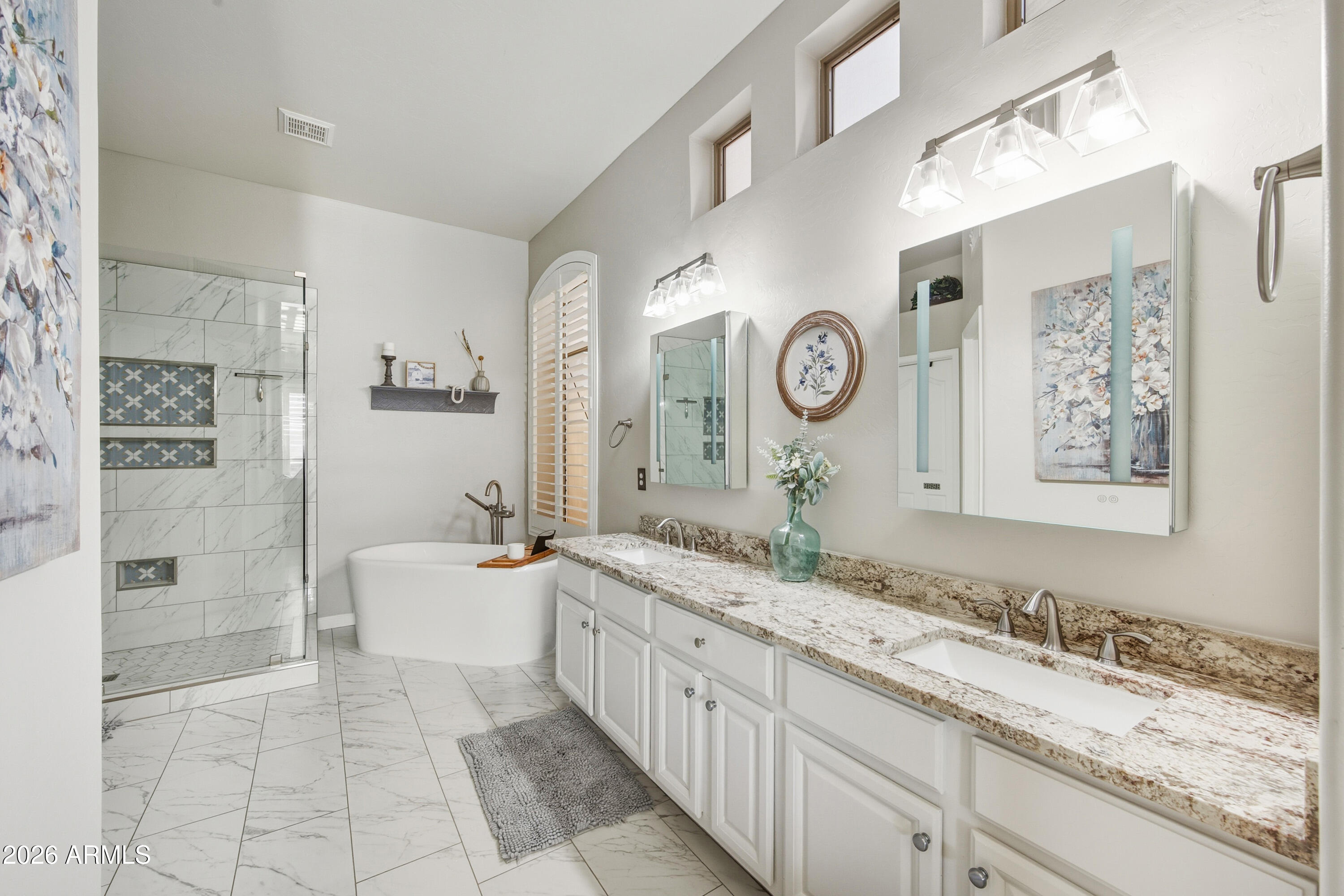 16635 South 12th Avenue Phoenix, AZ 85045 - Photo 24 of 43 a spacious bathroom with a granite countertop sink mirror and bathtub