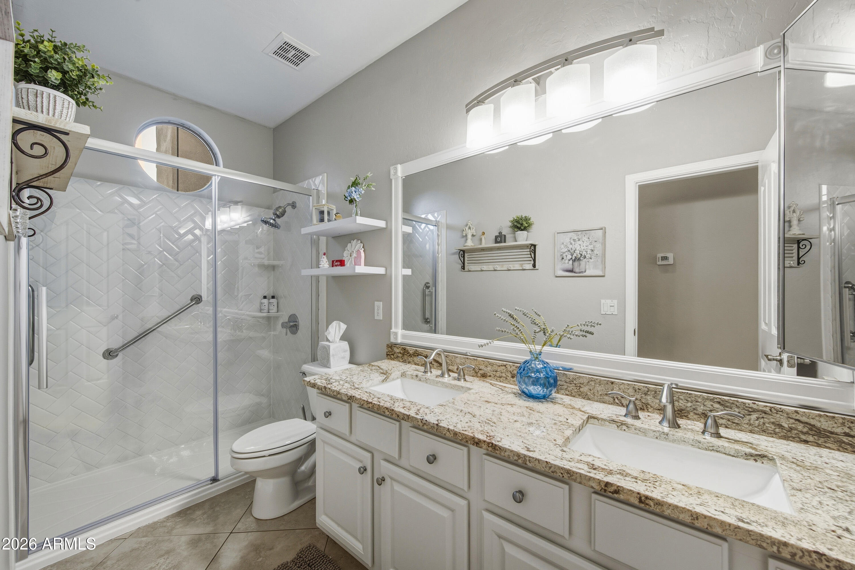 16635 South 12th Avenue Phoenix, AZ 85045 - Photo 30 of 43 a bathroom with a granite countertop sink mirror and toilet
