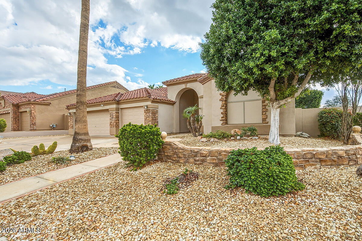 16635 South 12th Avenue Phoenix, AZ 85045 - Photo 3 of 43 a front view of a house with garden