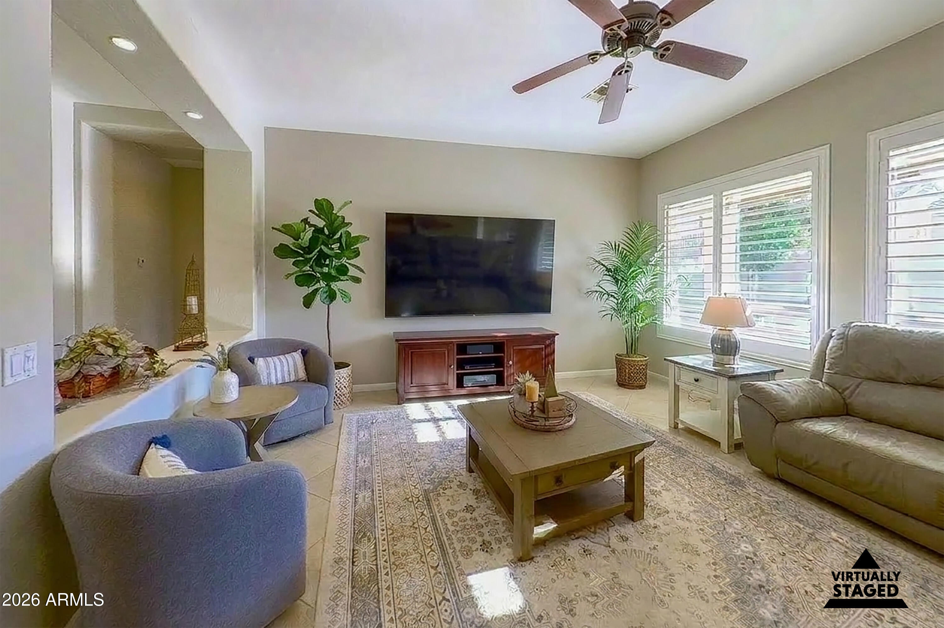 16635 South 12th Avenue Phoenix, AZ 85045 - Photo 7 of 43 a living room with furniture and a flat screen tv