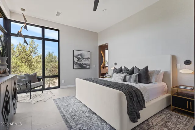 a bedroom with a large bed and a couch