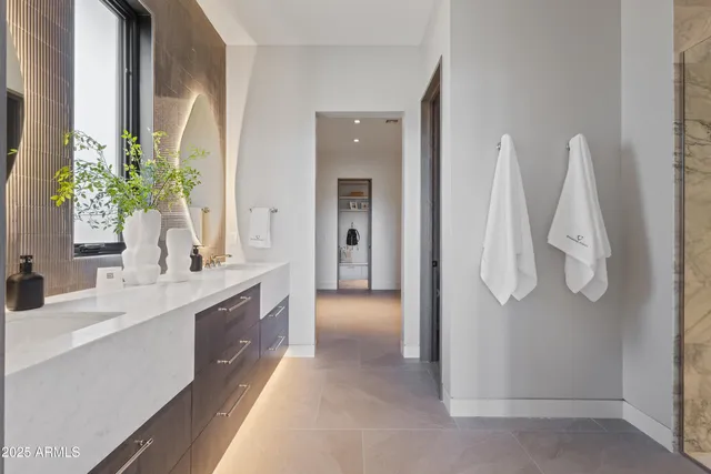 a bathroom with a double vanity sink and a mirror