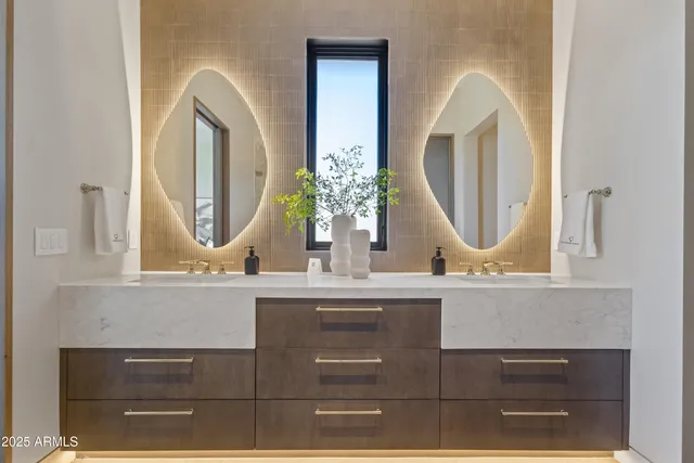 a bathroom with mirror a sink and a mirror